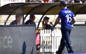 England's captain Eoin Morgan walks from the field after being caught by New Zealand's Trent Boult.