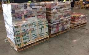 Cigarette cartons from inside the boxes in shipping container.