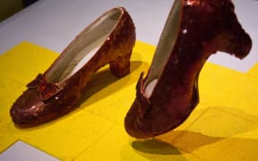 The famous ruby slippers worn by actress Judy Garland, in the character of Dorothy in the 'Wizard of Oz', on display 11 April, 2012 at the Smithsonian Mueseum of American History in Washington, DC, during the press preview for 'American Stories'. AFP PHOTO/Karen BLEIER (Photo by KAREN BLEIER / AFP)
