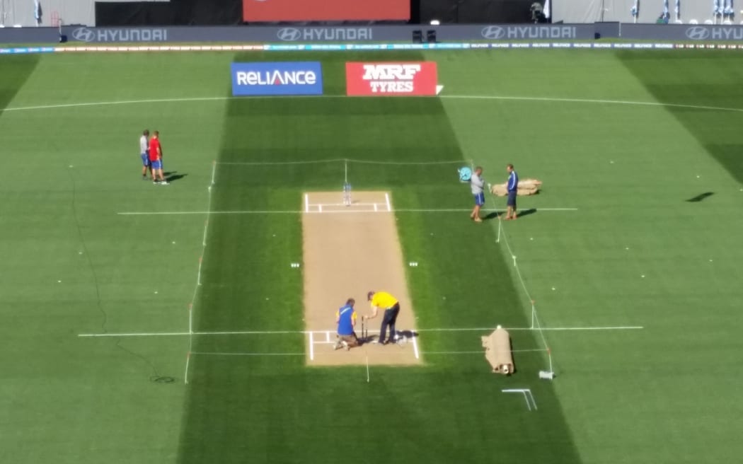 Ground staff prepare the Eden Park pitch ahead of the semi-final.