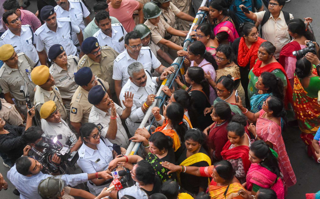 Police clashing with women from the Bharatiya Janata Party during a protest in Kolkata on 16 August, 2024, against the rape and murder of a second-year doctor at RG Kar Medical College.