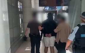 Two New Zealanders were detained at Sydney Airport after cocaine was allegedly found in luggage.