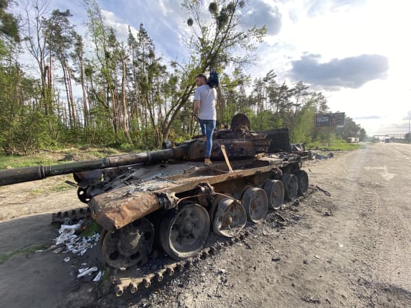 Daniel Pannett getting footage of a Russian tank on a highway to Kyiv, Ukraine.