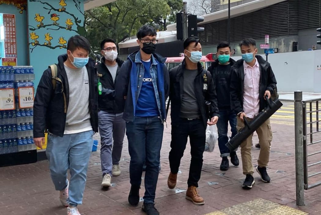 Pro-democracy activist Ventus Lau Wing-hong (third left) is arrested on 6 January 2021 in Hong Kong.