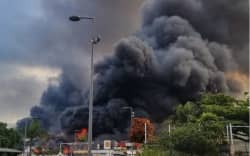 A large plume of black smoke in New Caledonia during civil unrest.