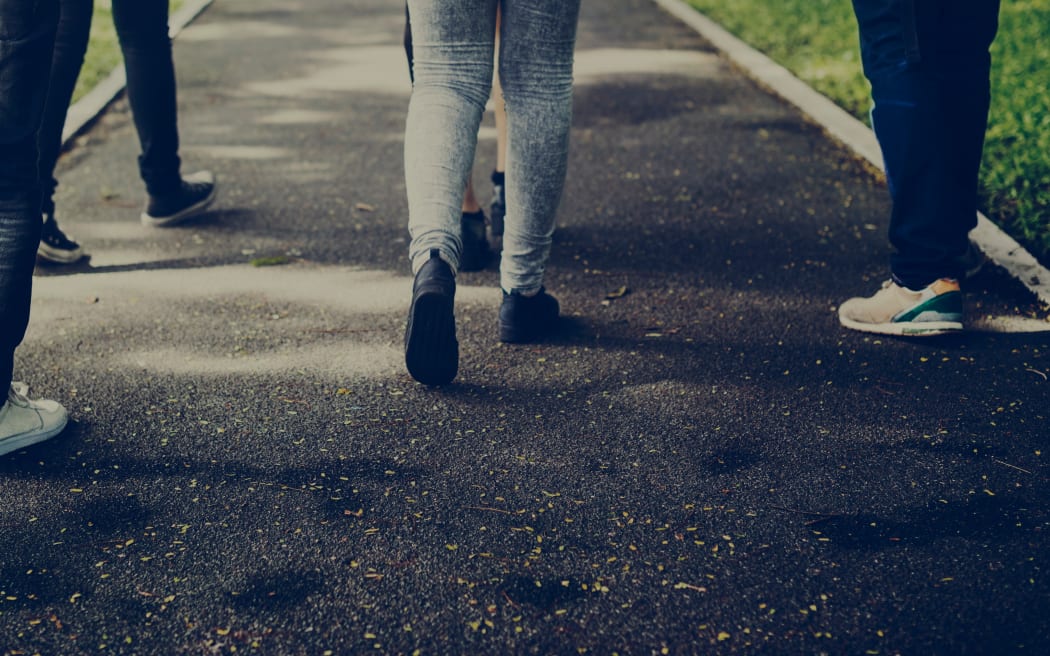 Group walking on footpath.
