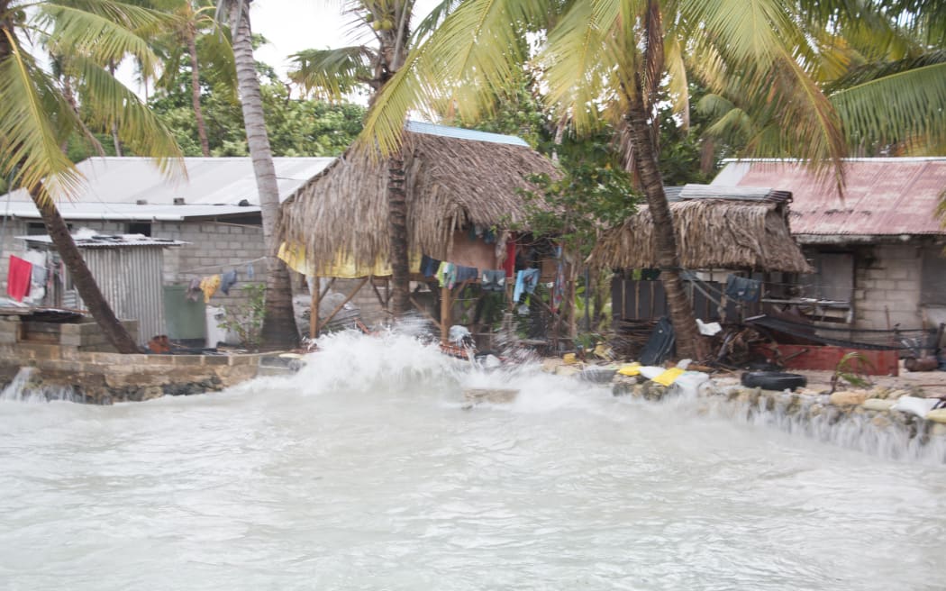 King tides hitting housing in Kiribati.