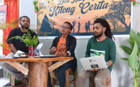 Papua Voices chair Harun Rumbarar (from left), VI Papua Film Festival Committee chair Iren Fatagur, and Markus Wayeni during a media conference at the Papuan Voices secretariat on Monday.