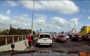 An armed man is chased and shot by Police after the Lincoln Road flyover at Henderson across State Highway 16 sh16 was  closed due to an armed incident 27 September 2023
picture supplied