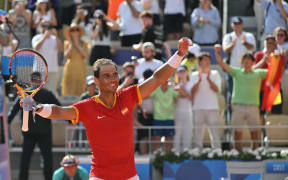 Spain's Rafael Nadal celebrates after beating Hungary's Marton Fucsovics in their men's singles first round tennis match on Court Philippe-Chatrier at the Roland-Garros Stadium at the Paris 2024 Olympic Games, in Paris on July 28, 2024.
