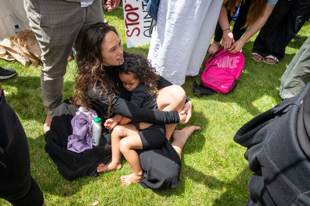 Many attendees were Maori, from regional towns and apparently less well off or educated, but not all. There were gangs and church groups, hippies and the far right, the disabled and elderly. And many families. Here one tamariki sleeps on through the din.