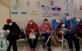 Covid-19 coronavirus patients rest in the Second Affiliated Hospital of Chongqing Medical University in China's southwestern city of Chongqing on December 23, 2022. (Photo by Noel CELIS / AFP)