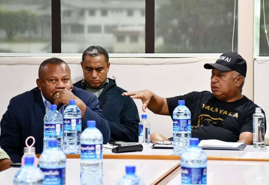 Fiji Prime Minister Frank Bainimarama, right, and Minister for Disaster Management Inia Seruiratu.