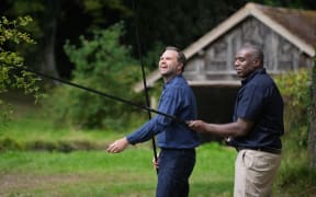 Britain's Foreign Secretary David Lammy (R) and US Vice President JD Vance (L) fish in the grounds of Chevening House, in Chevening, southeast England, on August 8, 2025. Lammy is hosting the US vice president and his family throughout the weekend for a private holiday at his country retreat in Chevening in Kent. The pair were expected to  discuss shared priorities and the UK-US relationship. (Photo by Kin Cheung / POOL / AFP)