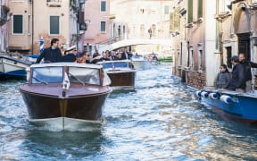 Italy's Prime Minister Giuseppe Conte (left) touring the city's canals on a taxi boat while assessing damages after Venice suffered its highest tide in 50 years.