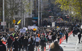 Thousands of anti-lockdown protestors march on the streets of the central business district of Sydney on July 24, 2021, as people gathered to demonstrate against the city's month-long stay-at-home orders.