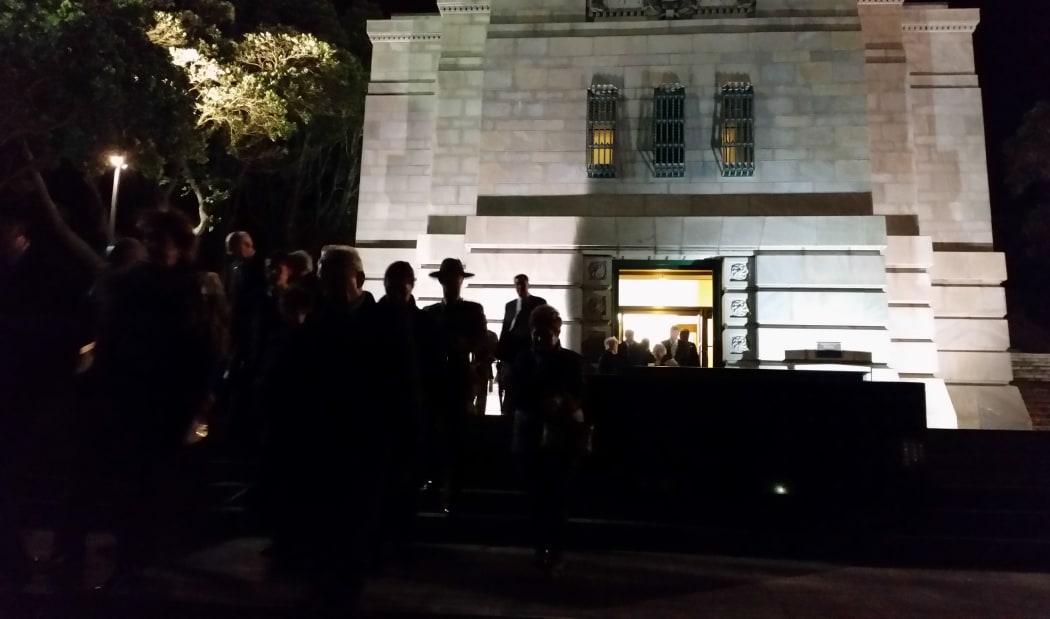 Guests outside the National War Memorial, during the pre-dawn blessing ceremony of the opening of the Pukeahu National War Memorial Park in Wellington.