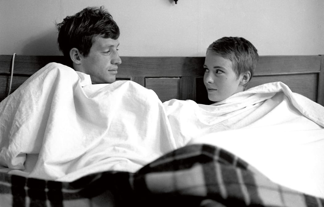 Movie still from the 1960 Jean-Luc Godard film Breathless featuring Jean-Paul Belmondo and Jean Seberg
