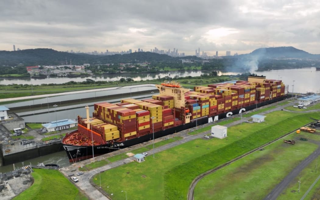 This handout picture released by the Panama Canal Authority on August 30, 2024, shows the container ship MSC Marie, of 366 meters long and 51 meters wide, transiting the Panama Canal in Panama. For its transit, it paid a toll of US$1,361,742. - A vessel capable of carrying 17,640 containers broke the record on Friday as the vessel with the largest capacity to cross the Panama Canal in its 110 years of operation, the Panama Canal Authority announced. (Photo by Handout / Panama Canal Authority / AFP) / RESTRICTED TO EDITORIAL USE - MANDATORY CREDIT "AFP PHOTO / PANAMA CANAL AUTHORITHY " - NO MARKETING NO ADVERTISING CAMPAIGNS - DISTRIBUTED AS A SERVICE TO CLIENTS