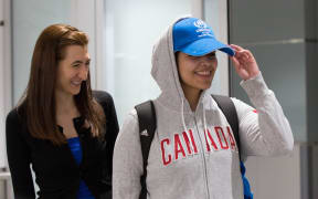 Saudi teenager Rahaf Mohammed al-Qunun (R) arrives at Pearson International airport in Toronto, Ontario.