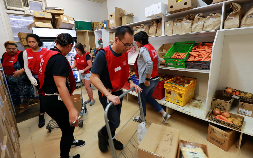 Volunteers help prepare the special Christmas parcels at Auckland's City Mission