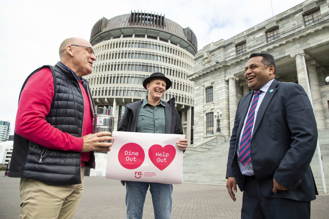 President of the Restaurant Association Mike Egan (L) and Association Vice President Steve Logan deliver lunch to Minister Kris Faafoi at Parliament, Wellington, Tuesday 25 August 2020. Credit: Hagen Hopkins.