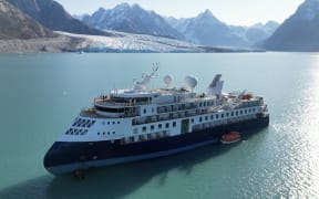 The cruise ship Ocean Explorer, operated by Australian company Aurora Expeditions, has been stuck in Alpefjord off Greenland's remote east coast since it ran aground on 11 September, 2023.