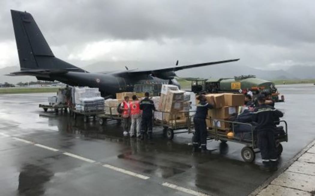 A French military plane is loaded with supplies bound for the cyclone-hit New Caledonia island of Lifou.
