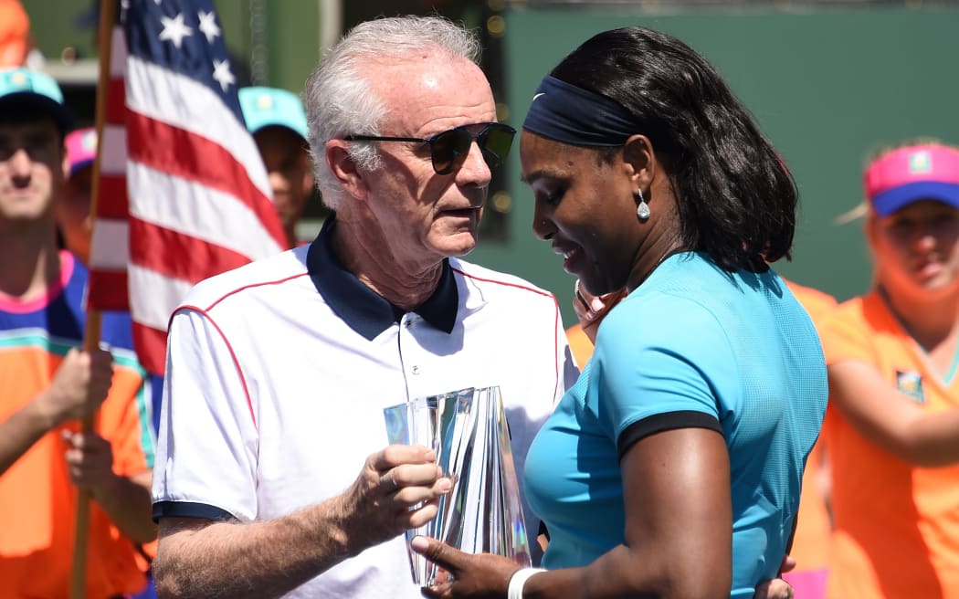 Raymond Moore presents the second place trophy to Serena Williams after the women's final of the BNP Paribas Open in March 2016.