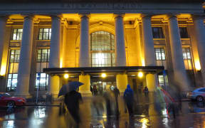 Commuters head into Wellington Railway Station.
