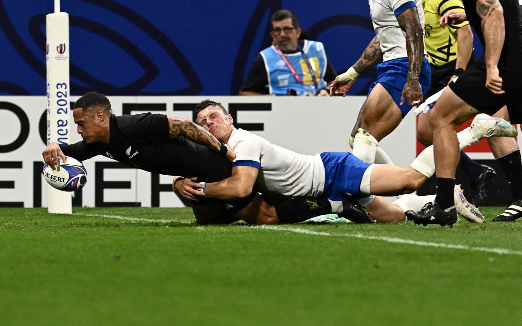 Aaron Smith scores one of his tries in the Rugby World Cup pool match against Italy at Lyon.