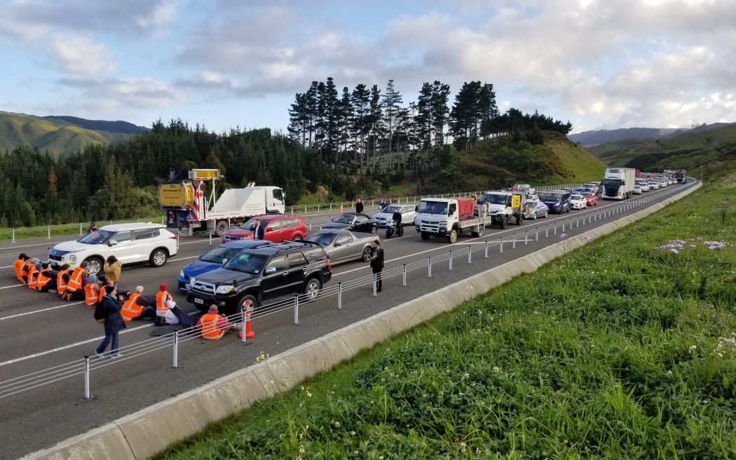 Protesters block traffic on Transmission Gully, Wellington, on 19 October 2022.