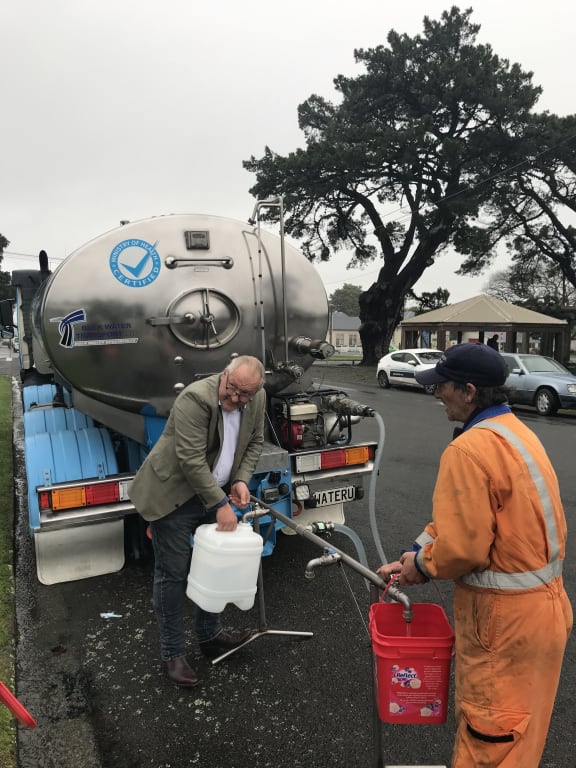 South Wairarapa Mayor Alex Beijen helps out during a water shortage in Featherston in June 2020