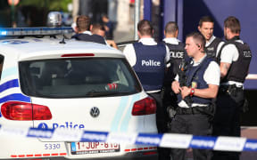 Police secure the area around a police building in Charleroi following the machete attack on 6 August 2016.