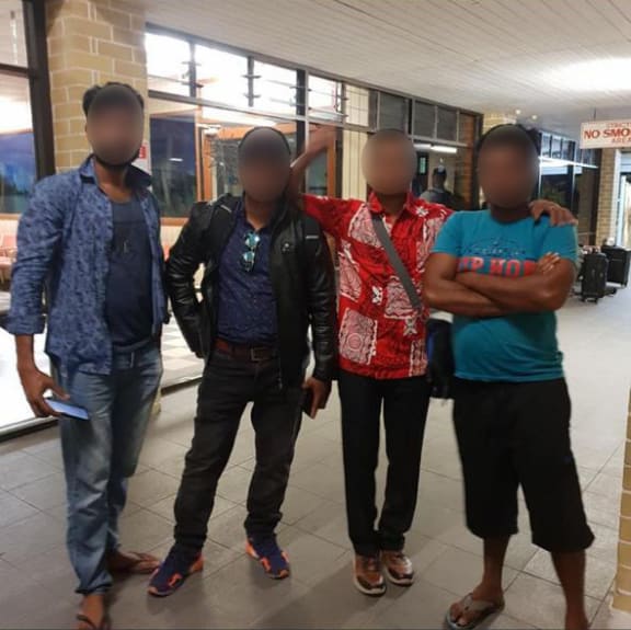 Four of the ten refugees bound for resettlement in the USA and Norway at the airport in Nauru. September 2020