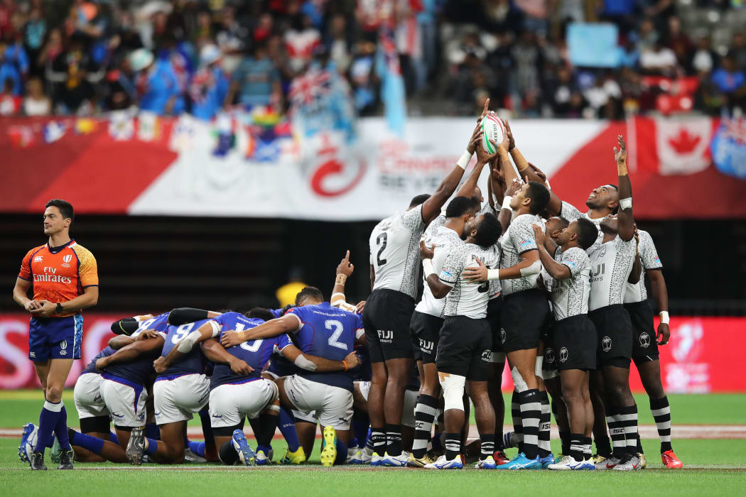 Fiji and Samoa pray before their pool clash in Vancouver.