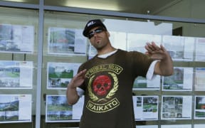 Tribal Huk gang member standing on Ngaruawahia's main street.