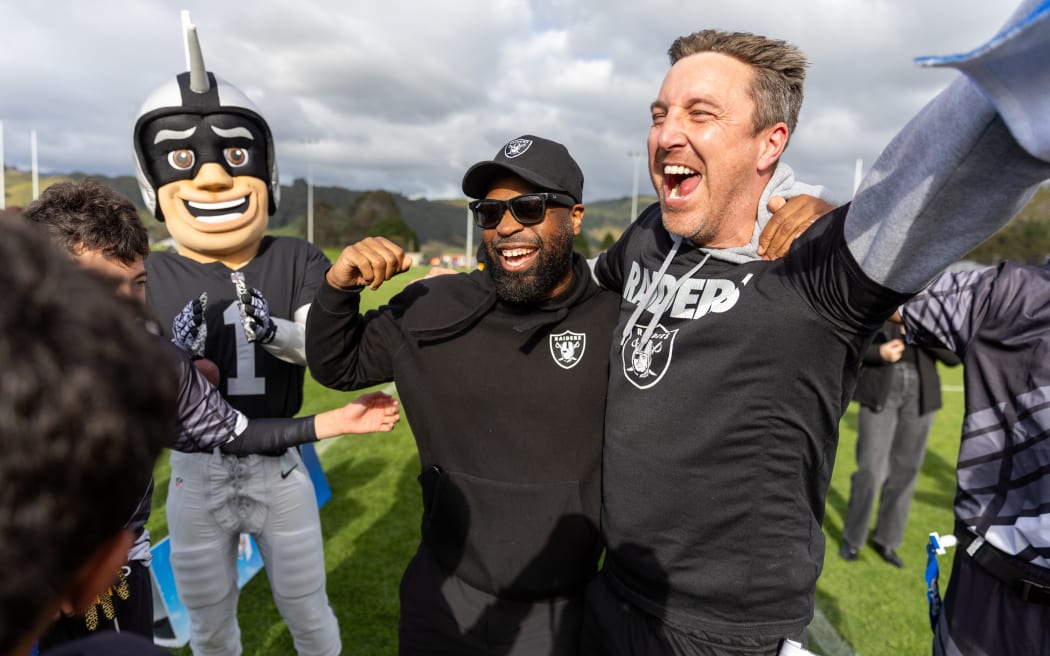 Las Vegas Raiders senior director football development, Myles Hayes (middle).