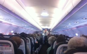 Passengers on a stranded plane at Christchurch Airport.