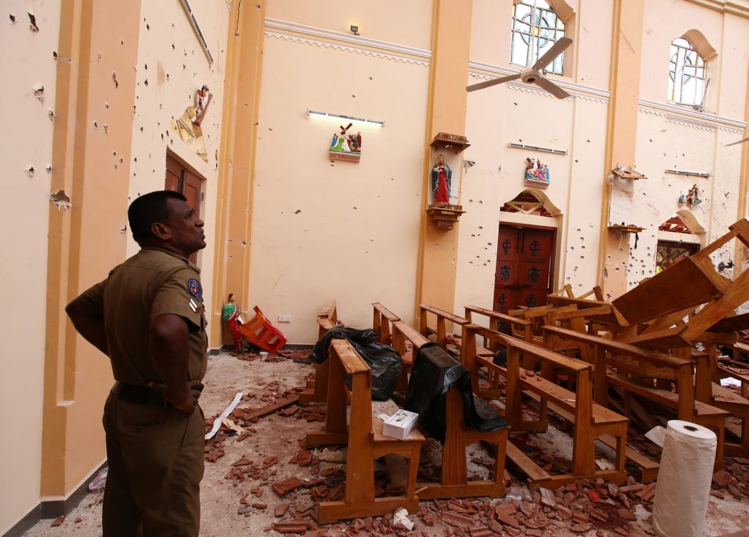 Officials inspect the damaged St. Sebastian's Church after multiple explosions targeting churches and hotels across Sri Lanka on Easter Sunday, April 21, 2019 in Negombo, north of Colombo, Sri Lanka.