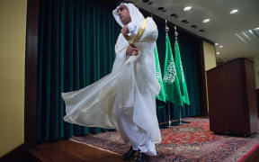 Saudi Foreign Minister Adel al-Jubeir leaves a Washington DC news conference following the release of 28 pages of a 9/11 Congressional report.