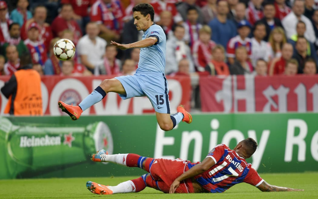 Jesus Navas of Manchester City and Jerome Boateng of Bayern Munich.