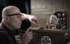 Australian animator and filmmaker Adam Elliot on the set of 'Memoir of a Snail' with one of his claymation characters.