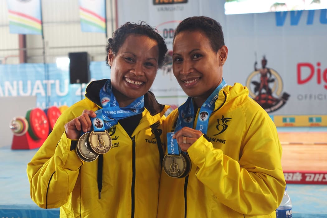 Papua New Guinea weightlifters Thelma and Dika Toua win the first gold medals at the Pacific Mini Games in Vanuatu. December 2017