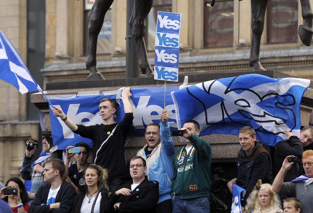Pro-Independence supporters demonstrate in Glasgow on the eve of Scotland's independence referendum.