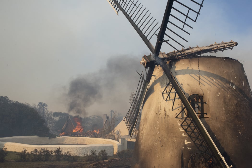 The historic Mostert's Mill in runs after a fire in the foothills of Table Mountain.