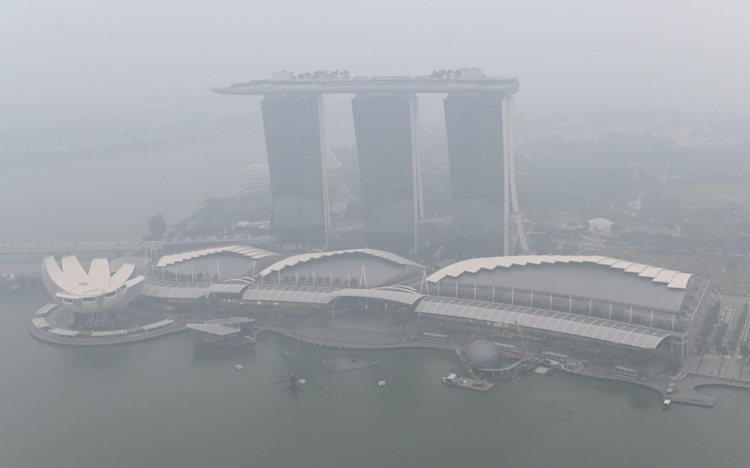 This overview shows the Marina Bay Sands hotel and resort blanketed by haze in Singapore on September 18, 2019.