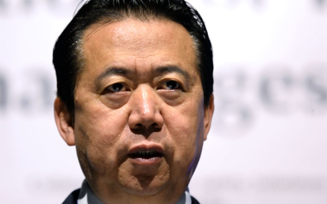 (FILES) In this file photo taken on July 4, 2017, Meng Hongwei, president of Interpol, speaks at the opening of the Interpol World Congress in Singapore.