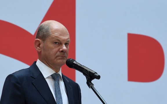 German Finance Minister, Vice-Chancellor and the Social Democrats (SPD) candidate for Chancellor Olaf Scholz delivers a press statement at the party's headquarters in Berlin on September 27, 2021,