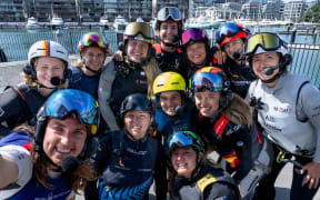 (L-R) Anna Barth, strategist of Germany SailGP Team, Giulia Fava, strategist of Red Bull Italy SailGP Team, Hannah Mills, strategist of Emirates Great Britain SailGP Team, Liv Mackay, strategist of New Zealand SailGP Team, Anna Weis, grinder and jib trimmer of USA SailGP Team, Maud Jayet, strategist of Switzerland SailGP Team, Martine Grael, driver of Mubadala Brazil SailGP Team, Natasha Bryant, strategist of Australia SailGP Team, Anne-Marie Rindom, strategist of ROCKWOOL Denmark SailGP Team, Nicole van der Velden, strategist of Spain SailGP Team, Annie Haegar, strategist of Canada NorthStar SailGP Team and Manon Audinet, strategist of France SailGP Team take a selfie in front of the city skyline ahead of The Rolex SailGP 2025 Championship ITM New Zealand Sail Grand Prix in Auckland, New Zealand. Thursday 16 January 2025. Photo: Ricardo Pinto for SailGP. Handout image supplied by SailGP